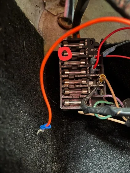 Fuse panel and wiring under inspection
